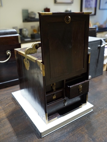 Dark Hardwood Cabinet With Metal Mounts