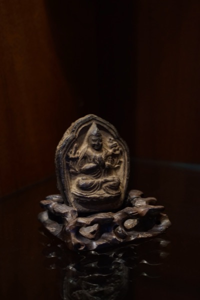 Seated Figure Votive Plaque